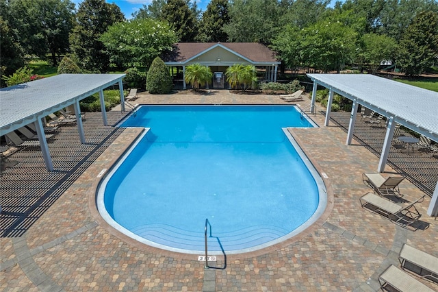 view of swimming pool featuring a patio area