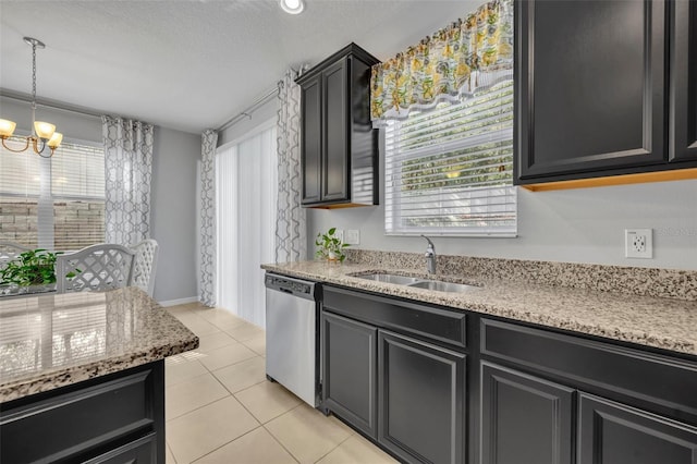 kitchen with sink, a chandelier, hanging light fixtures, light tile patterned floors, and dishwasher