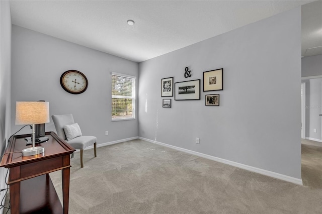 living area featuring light colored carpet