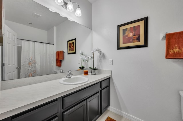 bathroom with vanity and a shower with shower curtain