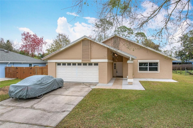 single story home featuring a garage and a front yard