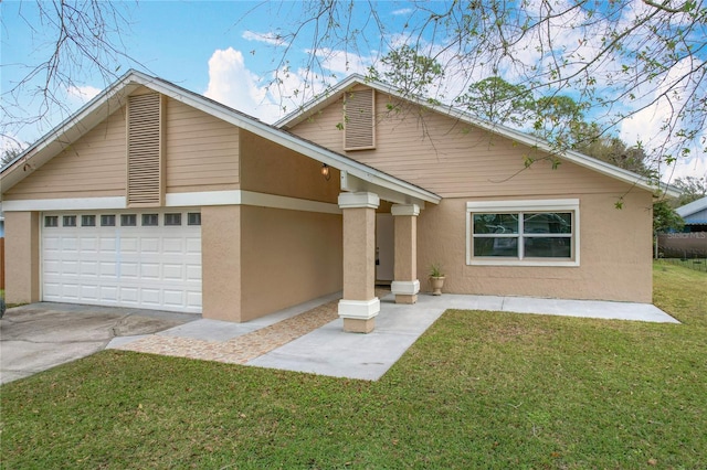 view of front of property featuring a garage and a front lawn