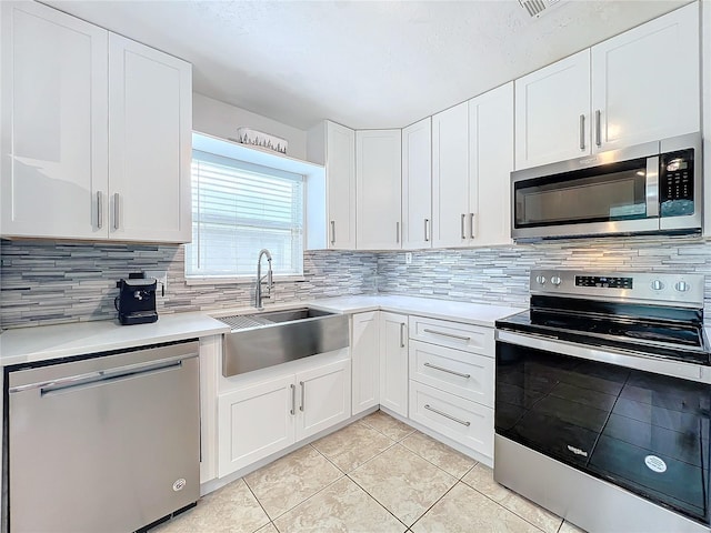 kitchen with white cabinetry and stainless steel appliances