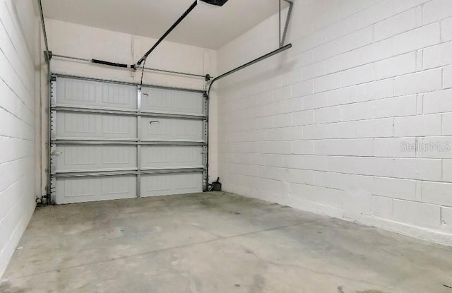 garage with concrete block wall