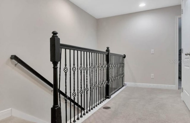 stairway featuring baseboards, carpet flooring, and recessed lighting