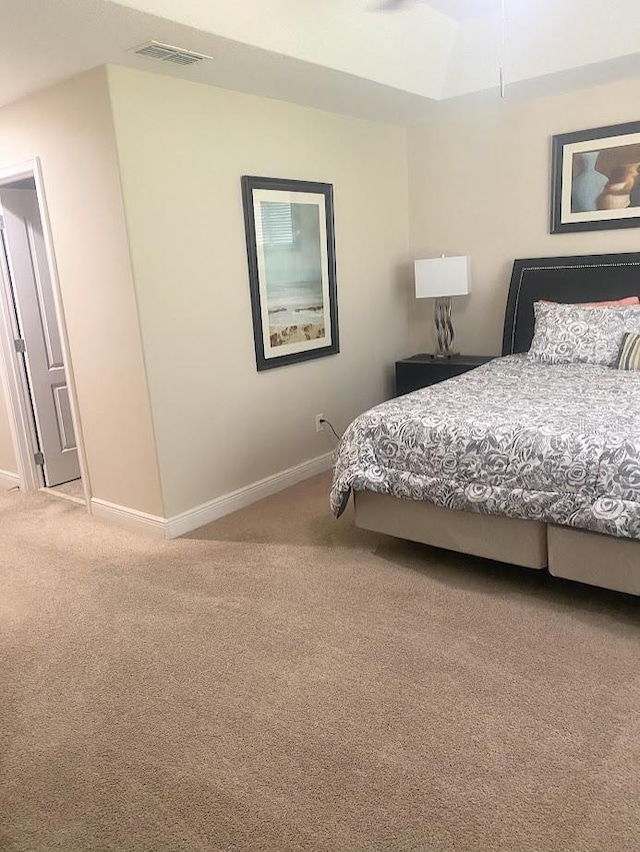 bedroom featuring carpet, visible vents, and baseboards