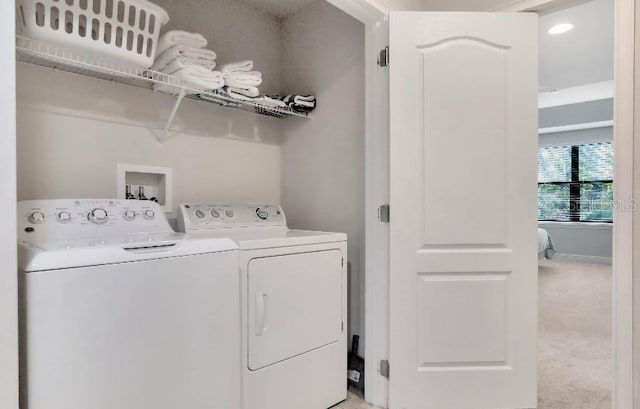 laundry room with light carpet, laundry area, and washing machine and dryer