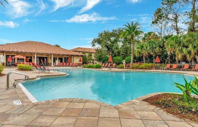 community pool with a patio