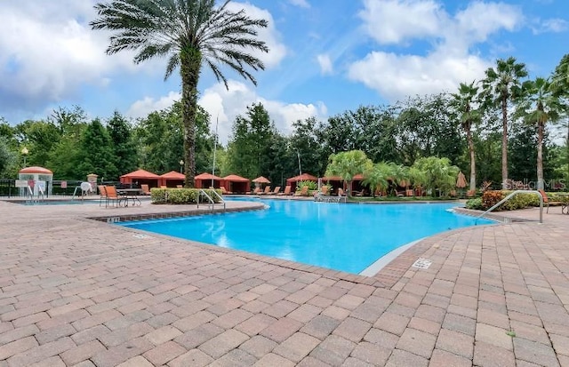 pool with a patio area