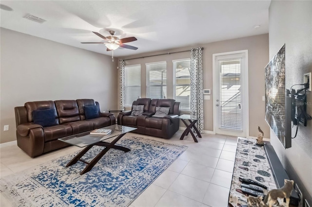 living room with light tile patterned floors and ceiling fan