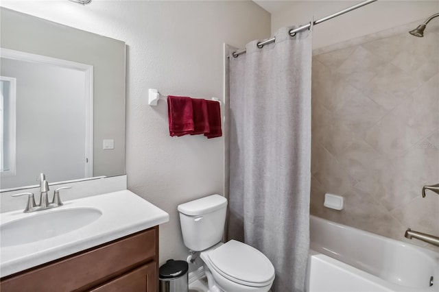 full bathroom featuring vanity, shower / tub combo, and toilet