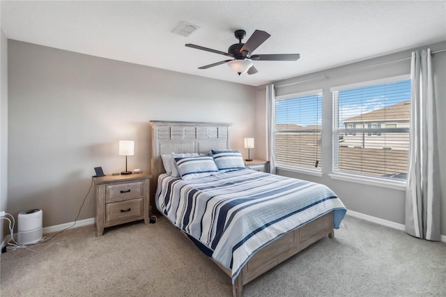 bedroom with light colored carpet and ceiling fan