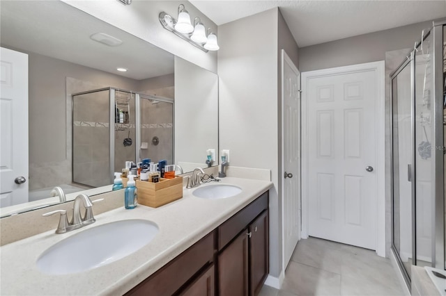 bathroom featuring walk in shower, tile patterned floors, and vanity