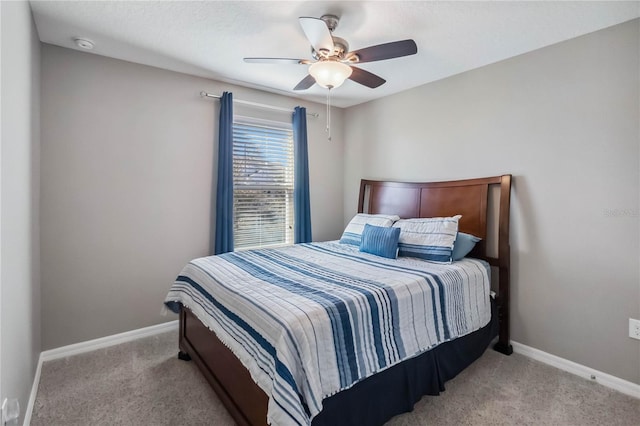 bedroom with light carpet and ceiling fan