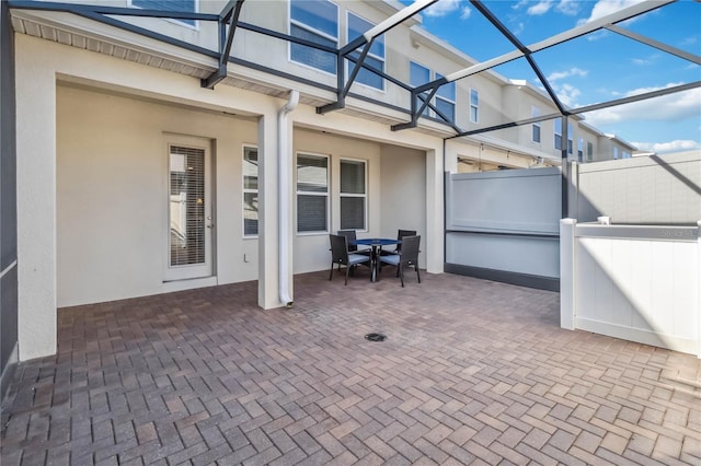 view of patio with a lanai