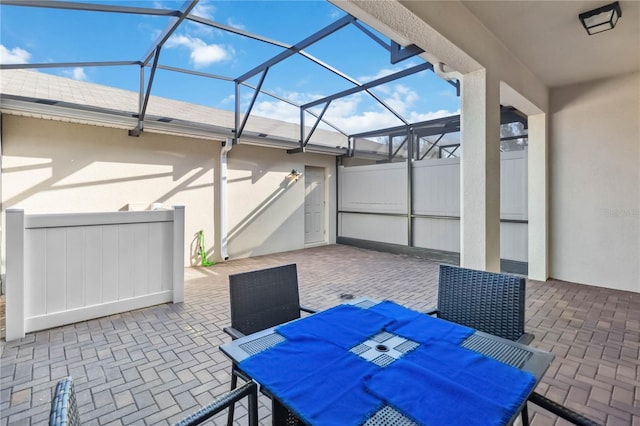 view of patio with a lanai