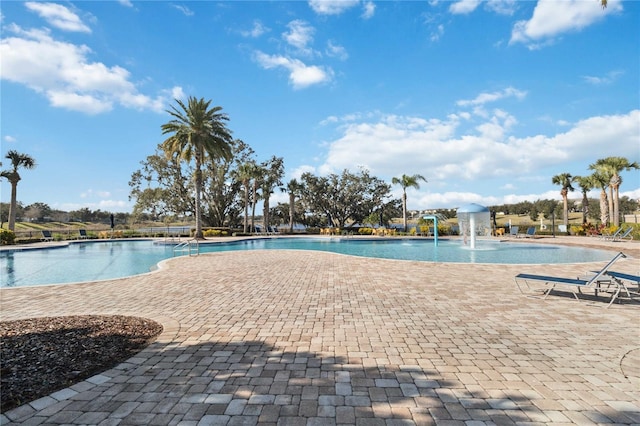 view of swimming pool featuring pool water feature