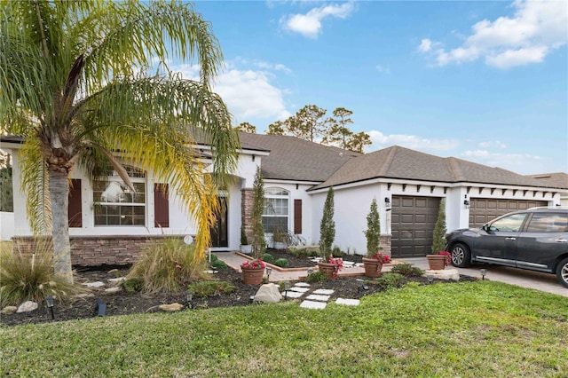 view of front of property with a garage and a front yard