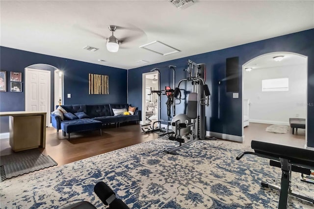 exercise room with hardwood / wood-style flooring