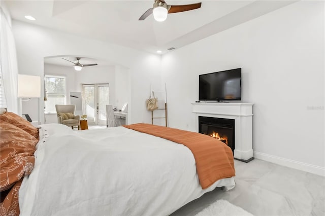 bedroom featuring french doors and ceiling fan