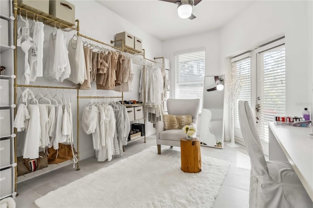 walk in closet featuring ceiling fan