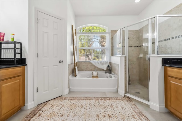 bathroom featuring tile patterned flooring, vanity, and independent shower and bath