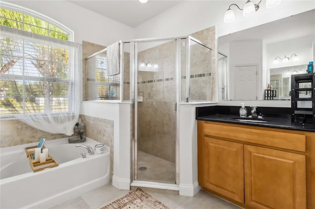 bathroom with tile patterned floors, vanity, plus walk in shower, and lofted ceiling