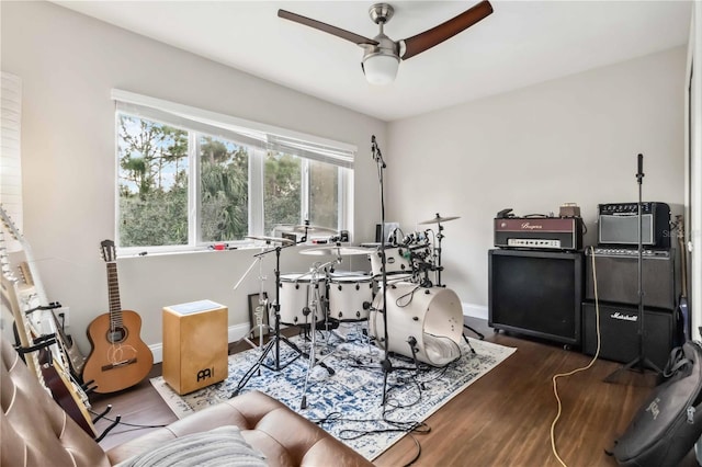 rec room featuring dark hardwood / wood-style floors and ceiling fan