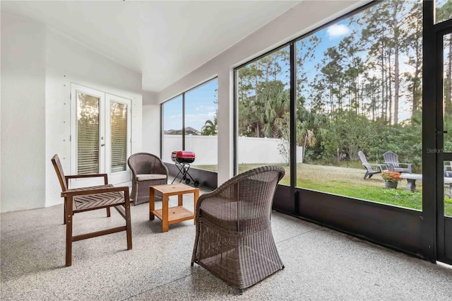 sunroom / solarium featuring french doors