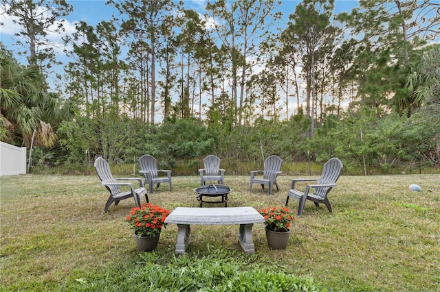 view of yard with an outdoor fire pit