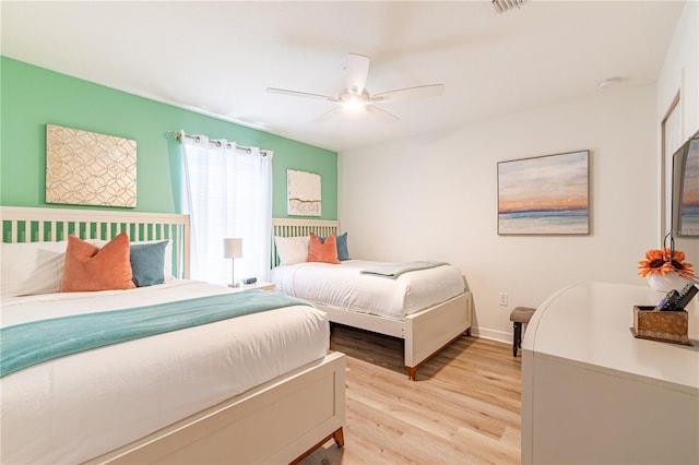 bedroom featuring ceiling fan and light hardwood / wood-style flooring