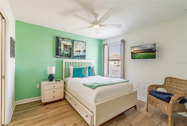 bedroom with ceiling fan and light wood-type flooring