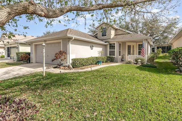 view of front of home with a garage, covered porch, and a front yard