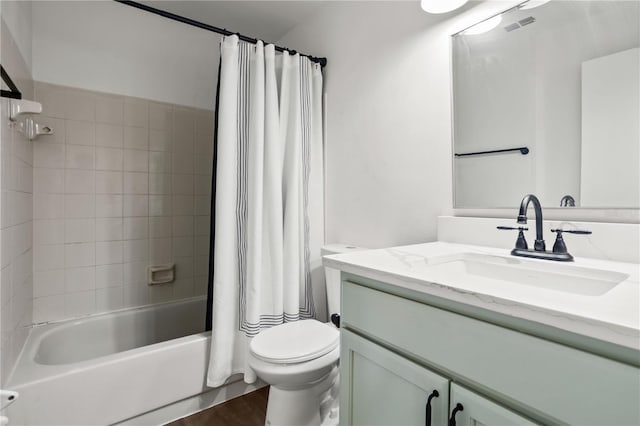 full bathroom with vanity, toilet, shower / tub combo, and hardwood / wood-style floors