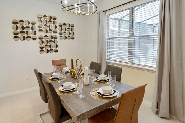8896 Bengal Ct, Kissimmee, FL 34747 - tiled dining room featuring plenty of natural light and a notable chandelier