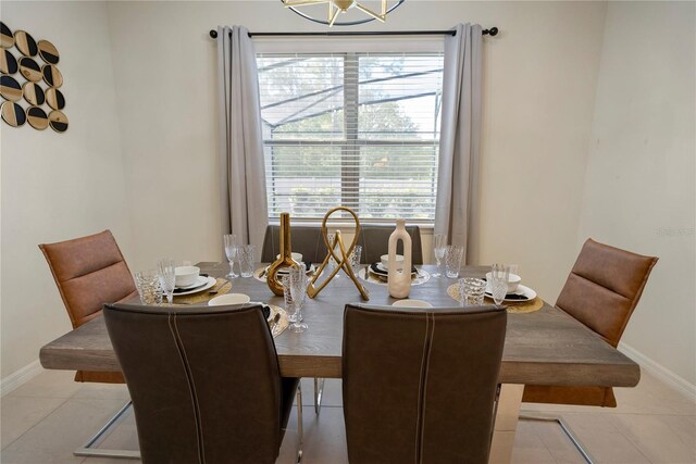 8896 Bengal Ct, Kissimmee, FL 34747 - tiled dining area featuring a chandelier