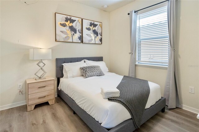 8896 Bengal Ct, Kissimmee, FL 34747 - bedroom featuring light hardwood / wood-style floors