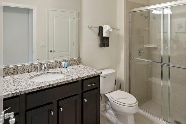 8896 Bengal Ct, Kissimmee, FL 34747 - bathroom with vanity, a shower with shower door, and toilet