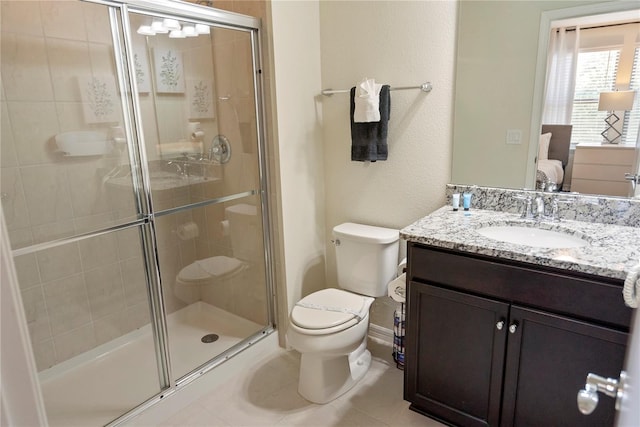 8896 Bengal Ct, Kissimmee, FL 34747 - bathroom with tile patterned flooring, vanity, a shower with shower door, and toilet