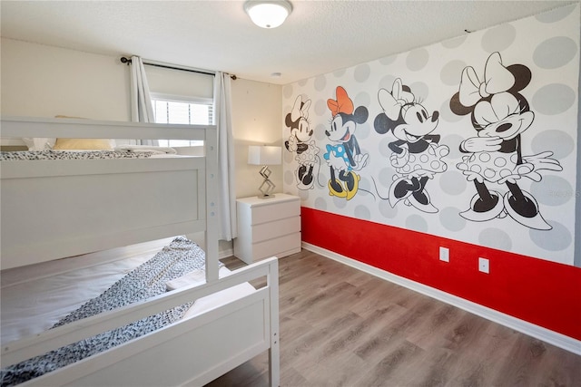 8896 Bengal Ct, Kissimmee, FL 34747 - bedroom with hardwood / wood-style flooring and a textured ceiling