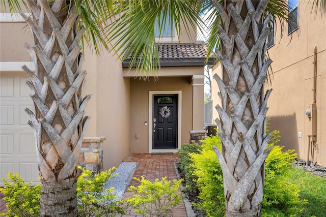 8896 Bengal Ct, Kissimmee, FL 34747 - property entrance with a garage