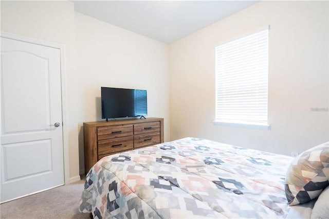 bedroom with light colored carpet