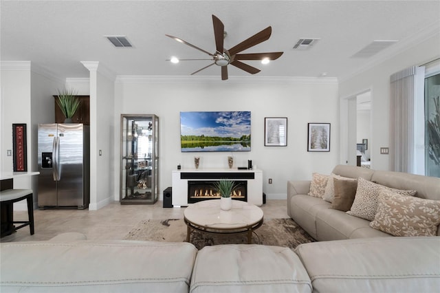 living room with crown molding and ceiling fan