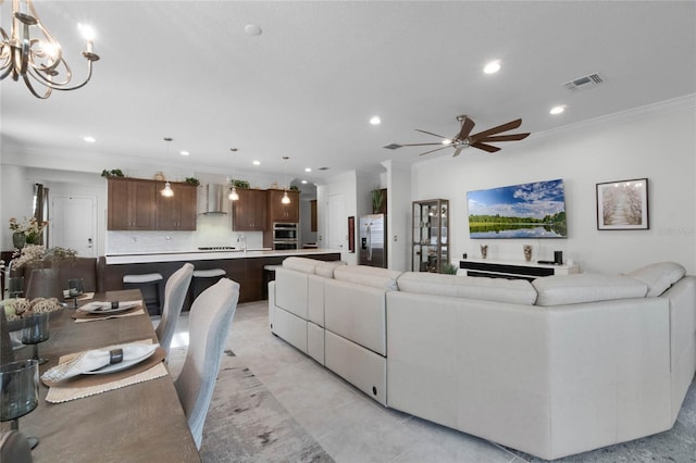 tiled living room with crown molding and ceiling fan