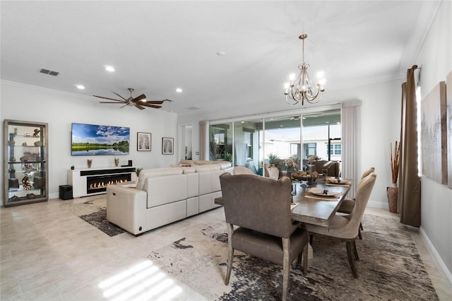 dining room featuring ornamental molding and ceiling fan with notable chandelier