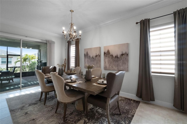 tiled dining room with an inviting chandelier and ornamental molding