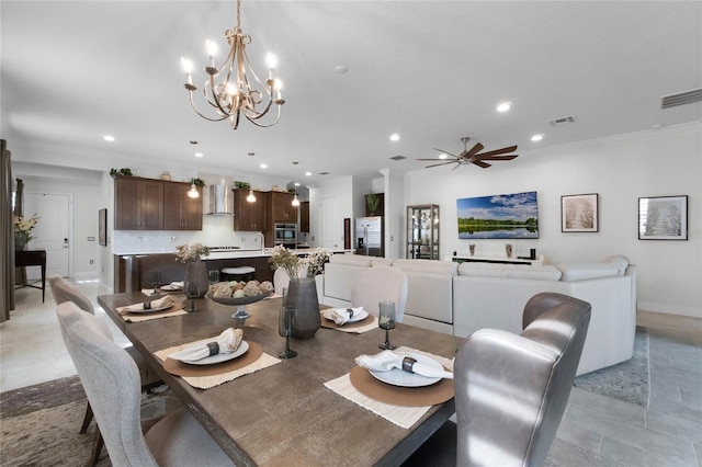 tiled dining area featuring ornamental molding and ceiling fan