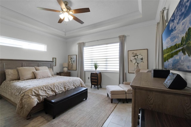 bedroom featuring crown molding, a tray ceiling, multiple windows, and light tile patterned floors