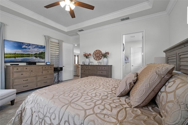 carpeted bedroom featuring ceiling fan, ornamental molding, and a raised ceiling