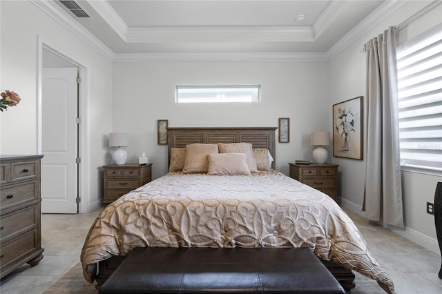 bedroom featuring crown molding and a tray ceiling